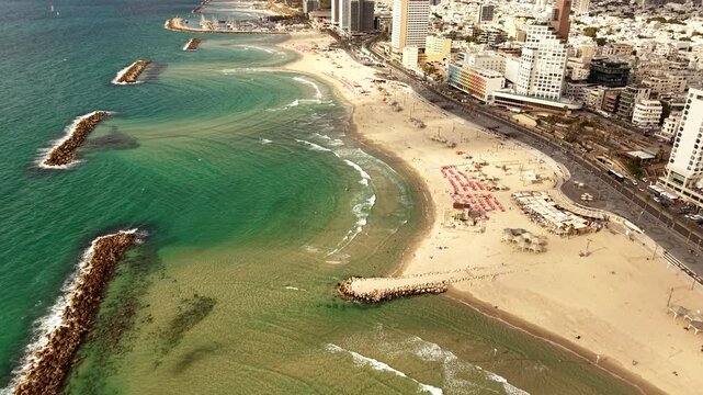 Aerial video of Tel Aviv Jaffa coastline in Israel during daylight 