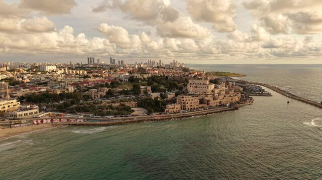 Aerial video of Tel Aviv Jaffa coastline in Israel during daylight 