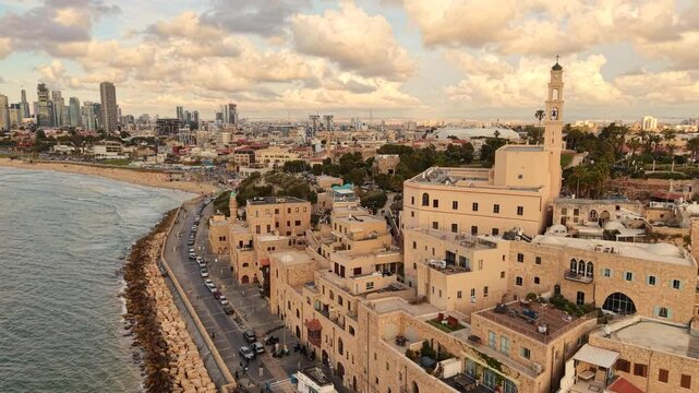 Aerial video of Tel Aviv Jaffa coastline in Israel during daylight 
