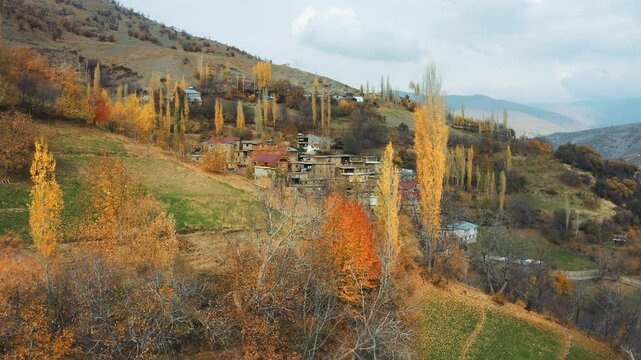 red churchThis drone image shows a mountain village in Hizan, Bitlis. Mudbrick and stone houses line the hillside, while poplar trees add colour to the landscape with the warm tones of autumn.