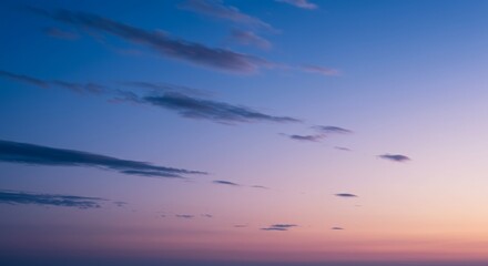 Obraz premium Sky Symphony: Capturing the mesmerizing dance of clouds as they drift across the gradient sky. It's a canvas of serenity and the promise of new beginnings. 