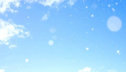 Obraz premium Ethereal winter sky with dreamy blue and white colors, featuring soft light and delicate snowfall particles that create serene and magical atmosphere