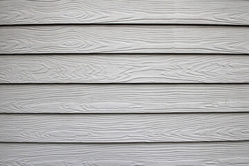 Painted white wood cladding on a house