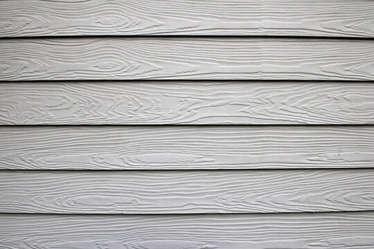 Painted white wood cladding on a house