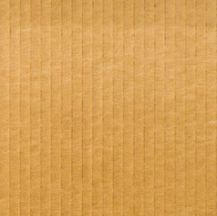 Texture of brown cardboard with vertical ridged pattern background