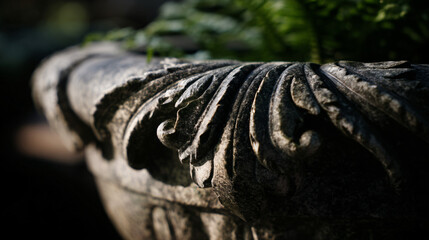 Elegant stone garden planter with an intricate invention perfect for home decor and horticulture themes.