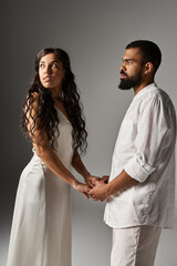 Stylish couple holding hands, embodying love and romance in a contemporary setting