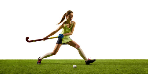 Female hockey athlete, dressed uniform, reaches forward with extended leg to take full control of...