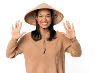 Young Filipina with Vietnamese hat showing number ten with hands.