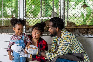 A farmer family is enjoying the organic eggs from their farm.