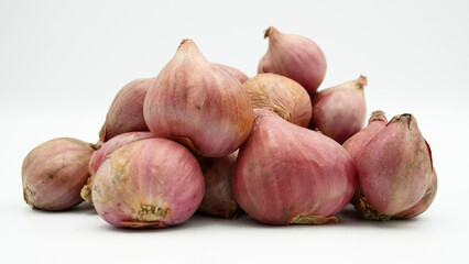 A group of fresh Shallots (Allium cepa) isolated on white background