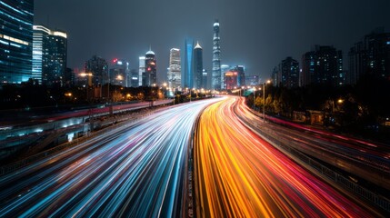 Fototapeta premium cityscape with blurred motion light trails from passing cars.