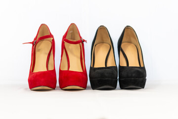 black and red pumps next to each other with a white background