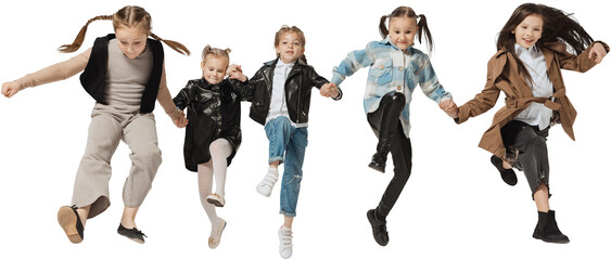Fototapeta premium Happy school and preschool age children, girls and boys running, jumping isolated on transparent background. Beauty, kids fashion, ad, education, happy childhood concept.