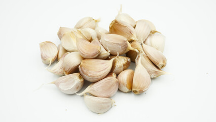 Fresh Peeled Garlic Bulb and Cloves isolated on white background