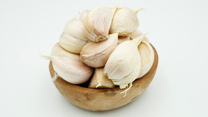 Fresh Peeled Garlic Bulb and Cloves isolated on white background