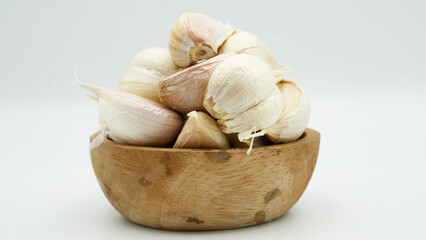 Fresh Peeled Garlic Bulb and Cloves isolated on white background