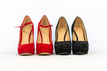 black and red pumps next to each other with a white background