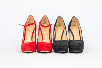 black and red pumps next to each other with a white background