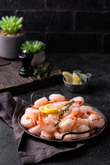 Frozen uncooked prawns or shrimps with lemon