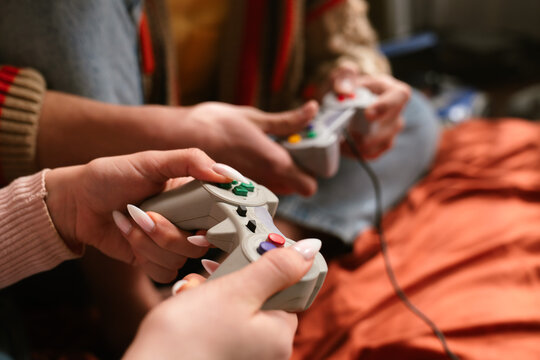 Group of Friends Playing Video Games Together Enthusiastically