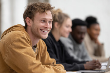 Fototapeta premium vibrant scene depicting young adults engaged in financial workshop learning about budgeting and saving