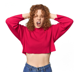 Young Caucasian redhead woman covering ears with hands trying not to hear too loud sound.