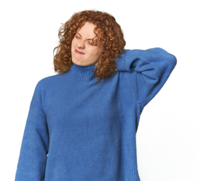 Young Caucasian redhead woman suffering neck pain due to sedentary lifestyle.