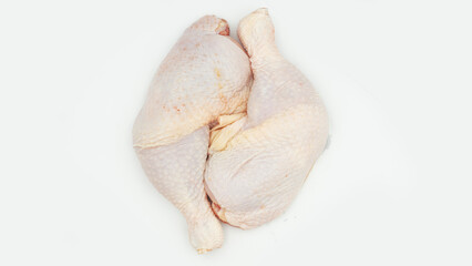 Chicken thighs  on a white background