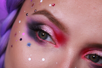 Colorful bold makeup with flowers and glitter effect. Summer party look for music festivals....