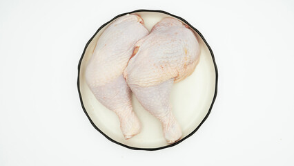 Chicken thighs  on a white background