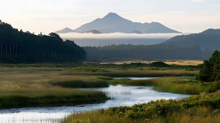 Tranquil mountain vista over a serene valley and river.