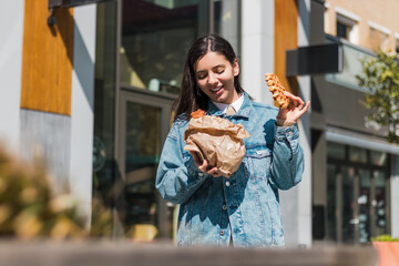 Chic woman relishing a waffle outdoors, capturing the vibe of spontaneous cravings and cozy solo...