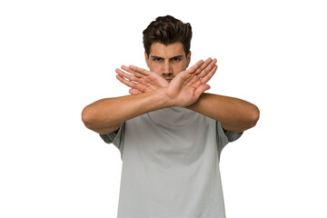 Young handsome caucasian man isolated on white background doing a denial gesture