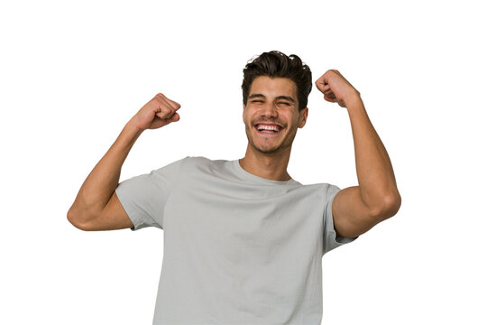 Young handsome caucasian man isolated on white background cheering carefree and excited. Victory concept.