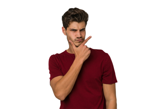 Young handsome caucasian man isolated on white background contemplating, planning a strategy, thinking about the way of a business.