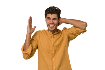 Young handsome caucasian man isolated on white background screaming with rage.