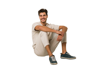 Young caucasian man sitting on the floor isolated on white background