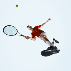 Low angle view of man, tennis player in motion racket, showing power agility and determination...