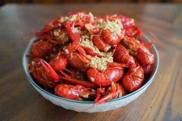 Closeup of Homemade Garlic Grayfish Placed on A White Bowl on Wooden Table