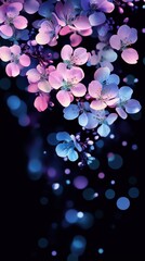 Glowing violet cherry blossoms on black background with surreal lighting
