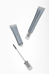 translucent cosmetic soft tube with slim mascara brush, Clear Mascara tube cosmetic packaging with spoolie brush mockup, glossy mascara wand, eyelash extention product in soft squeeze tube container