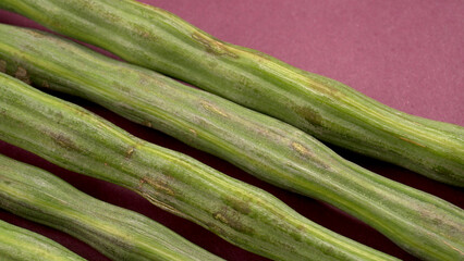 Fototapeta premium Drumstick image, some of peeled pieces of drumsticks. Drumstick or moringa is a very good and healthy vegetable.