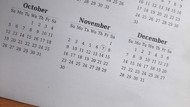 marking 7 November date on the calendar	
