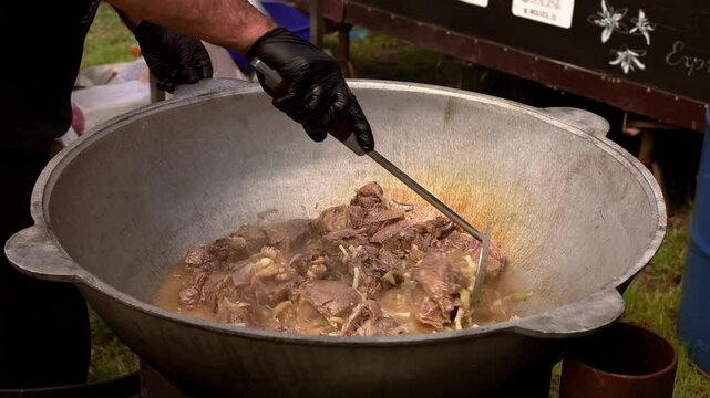 Cheff cooking fusion international cusine on street stall on international street food festival 