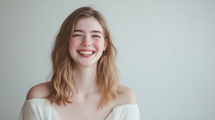 Fototapeta premium Young woman smiling happily