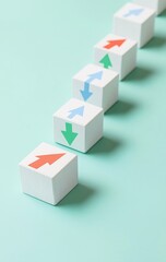 Series of white blocks with directional arrows, in a teal background
