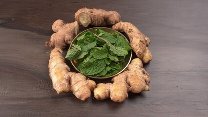 Ginger root vegetables and fresh mint leaves Concept health diet.
