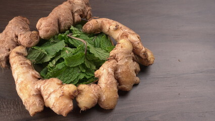 Ginger root vegetables and fresh mint leaves Concept health diet.
