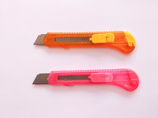 Plastic Craft Cutter in Bright Colors on white background